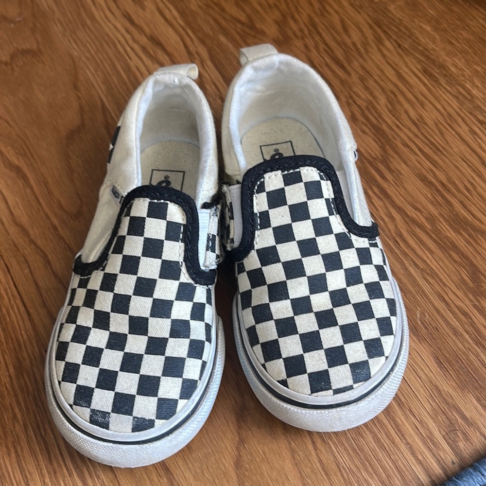 Black and white slip on Vans